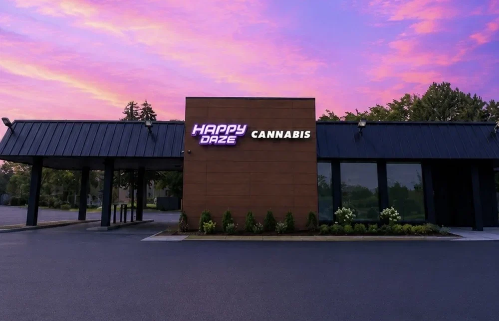 Happy Daze Mt Pleasant dispensary exterior beneath a pink-and-blue evening sky